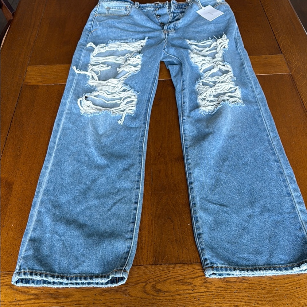 Distressed Blue Denim Jeans